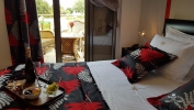 Кровать или кровати в номере Naiades Villas
