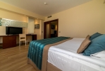 Кровать или кровати в номере Kamelya Selin Luxury Resort & SPA -Ultra All Inclusive
