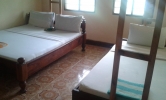 Кровать или кровати в номере Kihori Bungalows