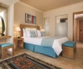 Кровать или кровати в номере Mövenpick Resort Soma Bay