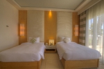 Кровать или кровати в номере Grand Rotana Resort & Spa