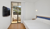 Кровать или кровати в номере Sol Cala Antena