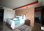 Кровать или кровати в номере Dreams Sands Cancun Resort & Spa - All Inclusive