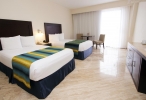 Кровать или кровати в номере Crown Paradise Club Cancun - Все включено