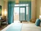Кровать или кровати в номере Sofitel The Palm, Дубай, Курорт и Спа