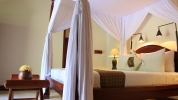 Кровать или кровати в номере Puri Wulandari - A Boutique Resort & Spa
