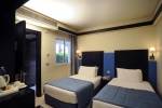 Кровать или кровати в номере Reef Oasis Blue Bay Resort & Spa