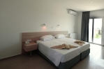 Кровать или кровати в номере Evabelle Napa Hotel Apartments 
