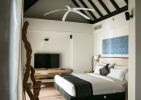 Кровать или кровати в номере Outrigger Konotta Maldives Resort