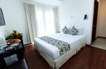 Кровать или кровати в номере Paragon Villa Hotel