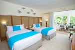 Кровать или кровати в номере Impressive Resort & Spa Punta Cana