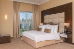 Кровать или кровати в номере Jannah Burj Al Sarab