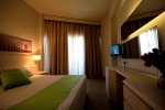 Кровать или кровати в номере Papouis Protaras Hotel ex smartline Protaras