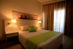 Кровать или кровати в номере Papouis Protaras Hotel ex smartline Protaras