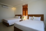 Кровать или кровати в номере Ola Phu Quoc Hotel