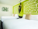 Кровать или кровати в номере Centara Karon Resort Phuket