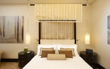 Кровать или кровати в номере The St. Regis Doha