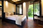 Кровать или кровати в номере MerPerle Hon Tam Resort