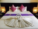 Кровать или кровати в номере Lae Lay Suites
