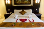 Кровать или кровати в номере Champlung Mas Hotel, Legian