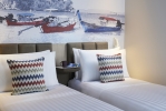 Кровать или кровати в номере OZO Phuket