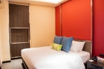 Кровать или кровати в номере Impiana Resort Chaweng Noi, Koh Samui