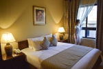 Кровать или кровати в номере Sunrise Marina Resort Port Ghalib