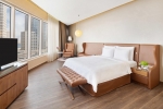 Кровать или кровати в номере Radisson Blu Hotel, Dubai Canal View
