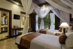 Кровать или кровати в номере Bali Tropic Resort & Spa