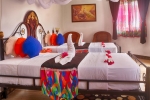 Кровать или кровати в номере Mermaids Cove Beach Resort & Spa