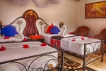 Кровать или кровати в номере Mermaids Cove Beach Resort & Spa