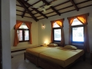 Кровать или кровати в номере Hotel Eva Lanka
