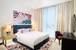Кровать или кровати в номере Millennium Al Barsha