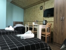 Кровать или кровати в номере Hotel Homeland
