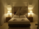 Кровать или кровати в номере Mare Dei Suites Hotel Ionian Resort