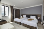 Кровать или кровати в номере Diamond Nhatrang Hotel