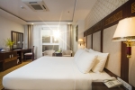 Кровать или кровати в номере Galliot Hotel
