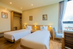 Кровать или кровати в номере Gaia Hotel Phu Quoc