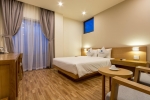 Кровать или кровати в номере Gaia Hotel Phu Quoc
