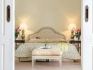 Кровать или кровати в номере Grecotel Mandola Rosa