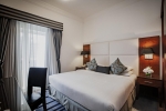 Кровать или кровати в номере Golden Sands Hotel (formerly Ramada Hotel & Suite)