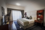 Кровать или кровати в номере Golden Sands Hotel (formerly Ramada Hotel & Suite)