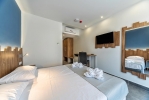 Кровать или кровати в номере Pollis Hotel