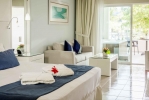 Кровать или кровати в номере Ocean Blue & Sand Beach Resort - All Inclusive
