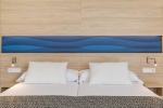 Кровать или кровати в номере Hotel Samos