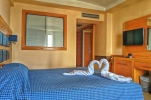 Кровать или кровати в номере Aegean Blue Beach Hotel