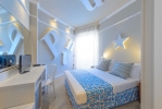 Кровать или кровати в номере Admiral Art Hotel