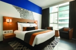Кровать или кровати в номере TRYP by Wyndham Dubai
