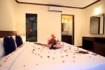 Кровать или кровати в номере Andaman Seaside Resort