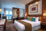 Кровать или кровати в номере Mediterranean Beach Hotel